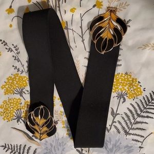 VTG belt black with yellow and black ornate buckle , stretches